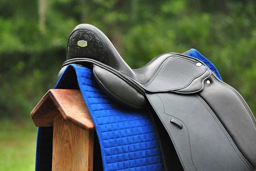 A saddle on top of a saddle, offered for Saddle Sales and saddle fit services.