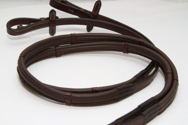 A brown leather ThinLine English Reins on a white surface.
