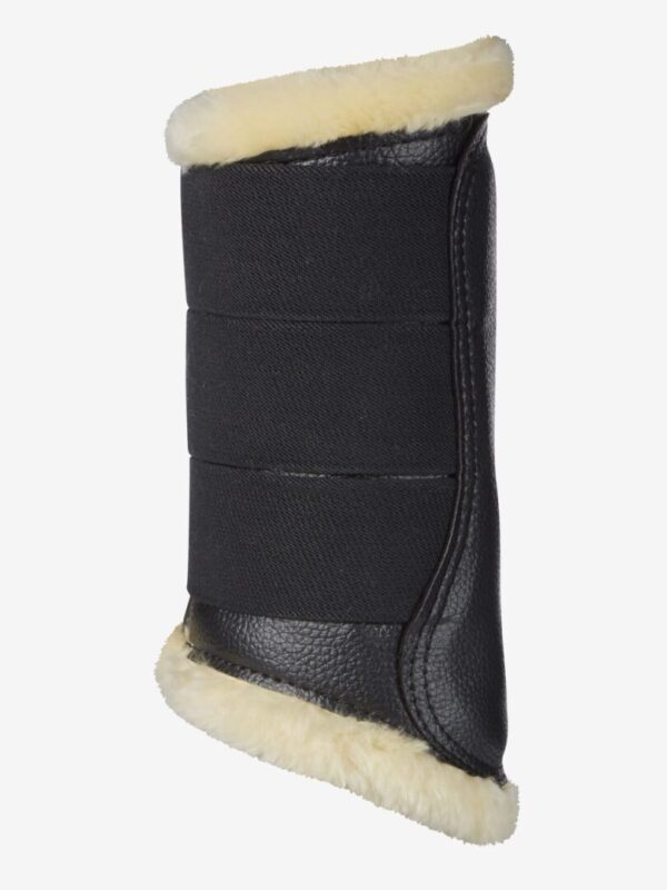 A pair of LeMieux Fleece Lined Brush Boots with a sheepskin lining.