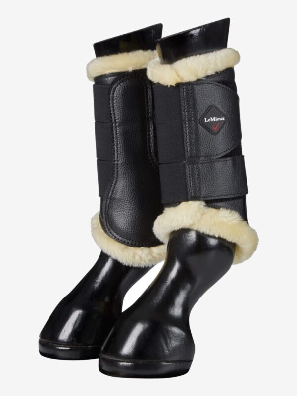 A pair of LeMieux Fleece Lined Brush Boots with sheepskin lining.