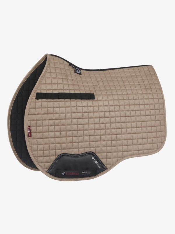 A tan LeMieux ProSport Suede General Purpose Square saddle pad with black trim.