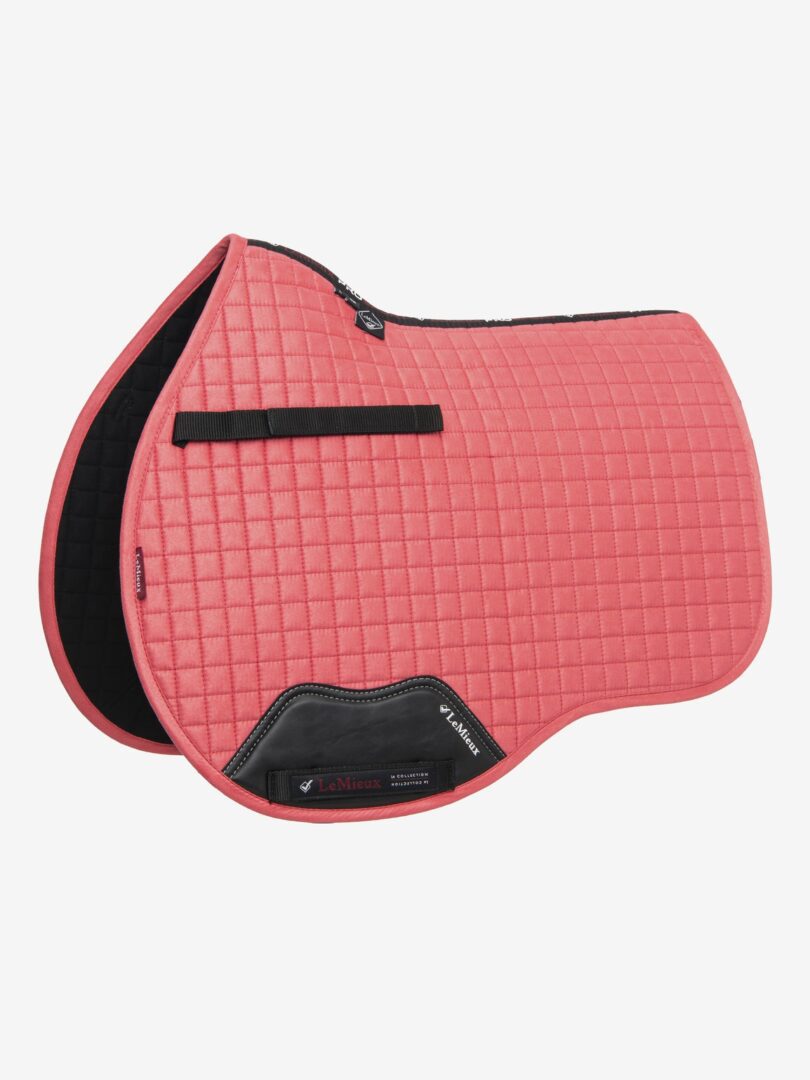 A pink and black LeMieux ProSport Suede General Purpose Square saddle pad.