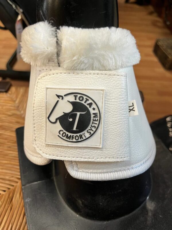 A pair of Tota Comfort Sport Bell Boots - White Fleece with a logo on them.