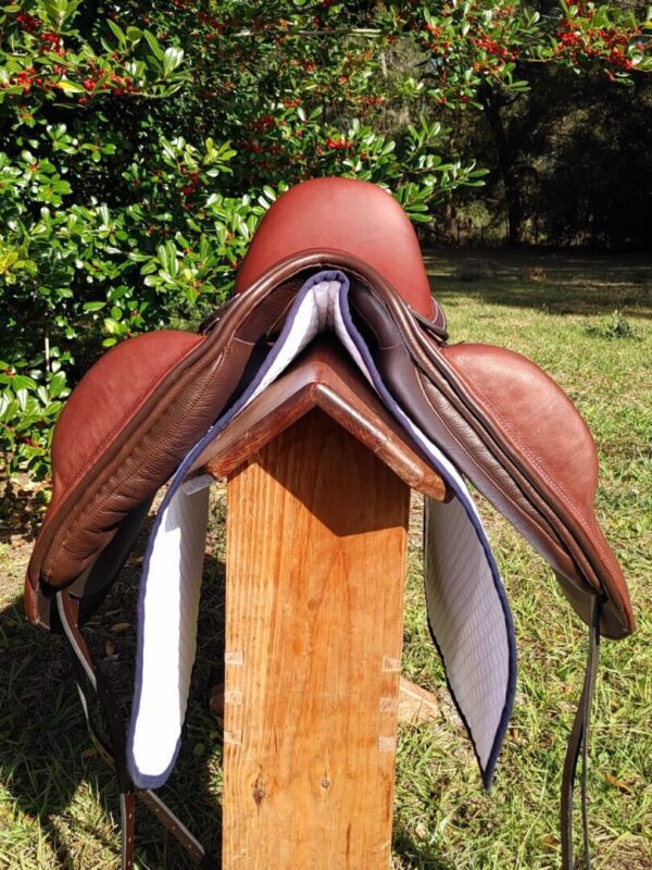 A Ryder Excellence Dressage R52 sitting on top of a wooden post.