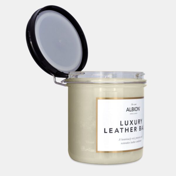 A jar with a lid that says Albion Swiss Leather Balm.