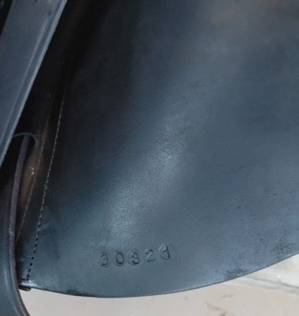 A close up of a black Custom Wolfgang Solo Dressage UC259 with a name on it.
