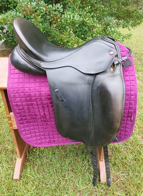An Albion SLK Ultima Dressage UC265 sitting on top of a purple blanket.