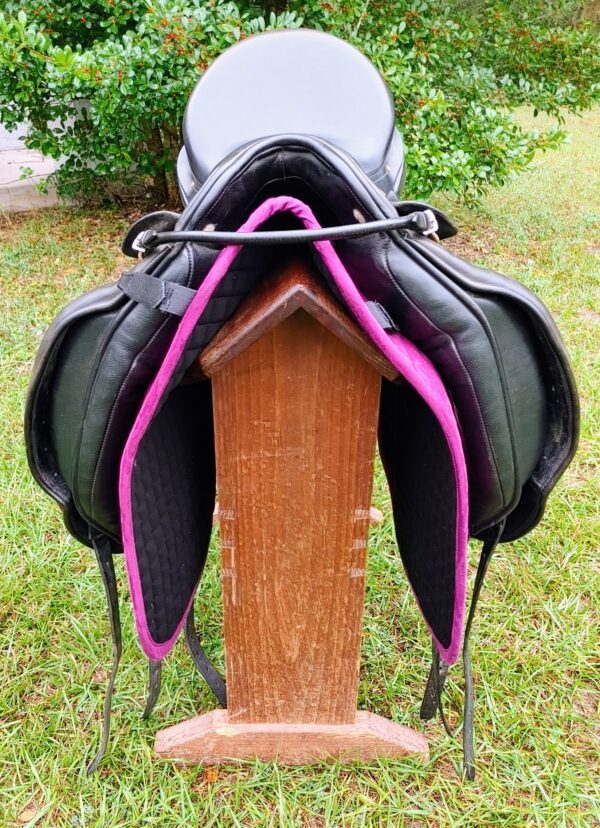 A black and purple Albion SLK Ultima Dressage UC265 on a wooden stand.