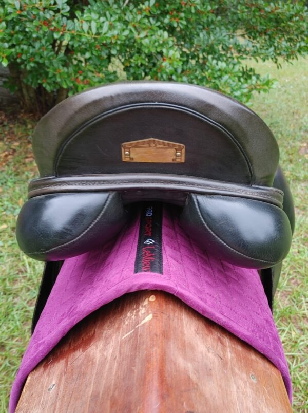 A black Albion SLK Ultima Dressage UC265 saddle with a purple blanket on it.