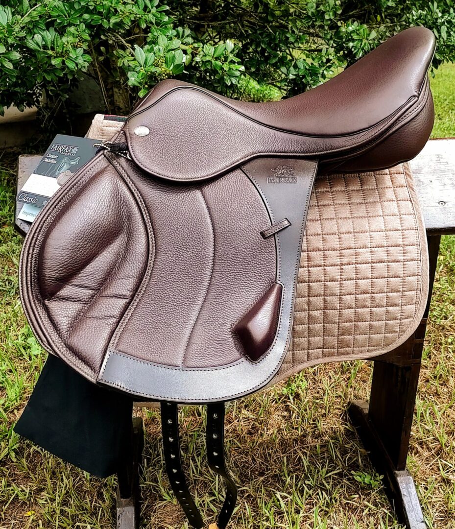 Dark brown textured saddle on beige quilted pad