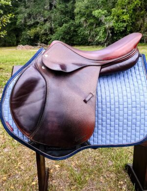 Left-side view of brown jumping saddle