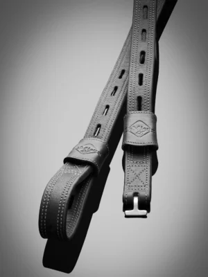 Leather guitar strap with adjustable holes.