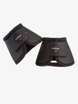 Black LeMieux horse boots on white background.