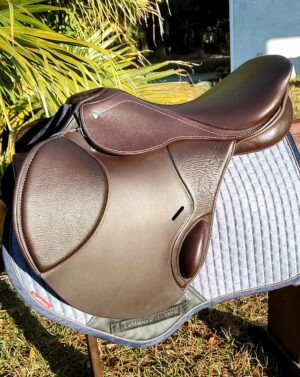 Brown leather English saddle on quilted pad