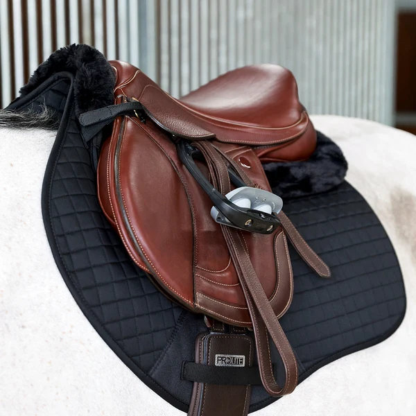 Brown English saddle on black quilted pad