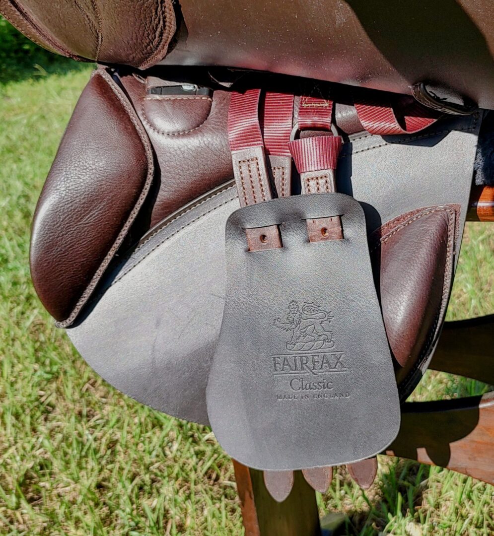 Saddle with leather underflap and straps.