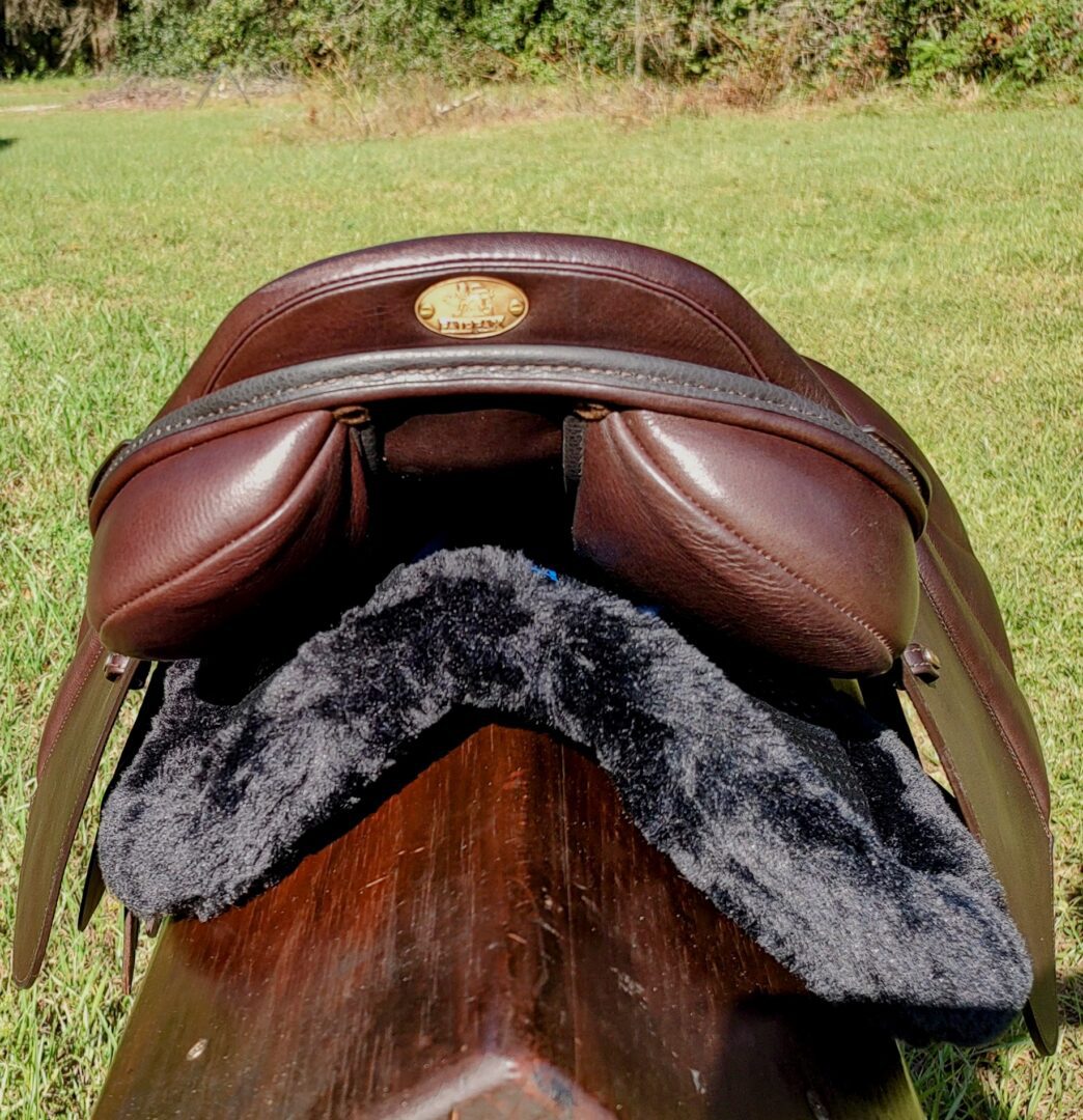 Brown saddle with black fleece lining view.